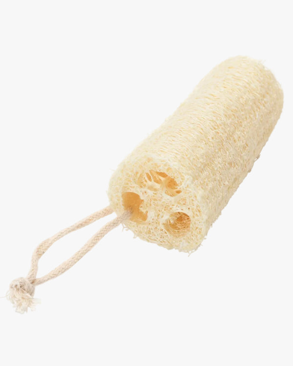 A natural beige loofah sponge with a cotton rope hanger against a white background.