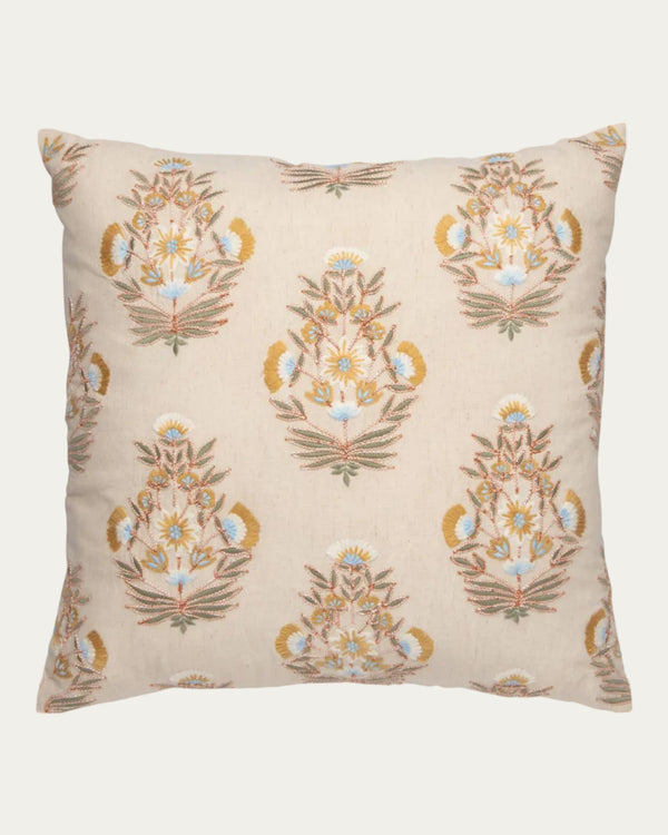 Decorative pillow with floral embroidery on a beige background