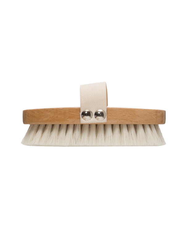 A beech wood bath brush with white bristles and an elastic band, featuring metal rivets.