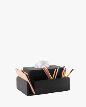 Black desk tissue holder/ organizer with stationery items on a white background
