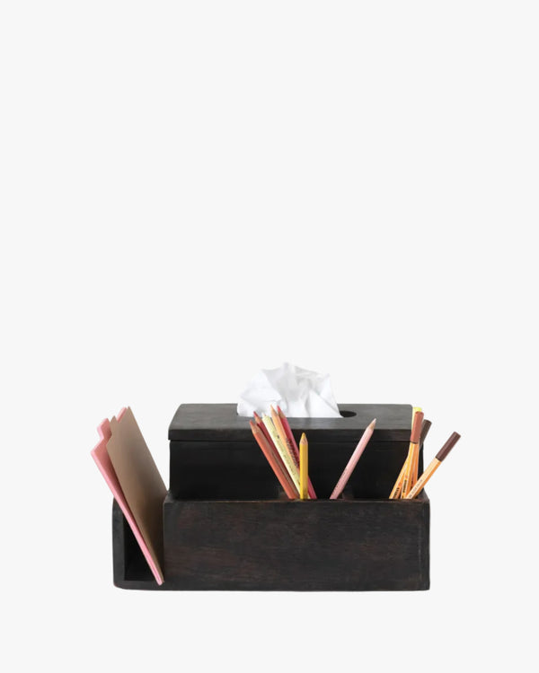 Black desk tissue holder/ organizer with stationery items on a white background