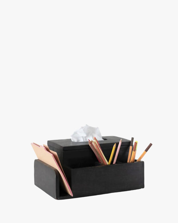 Black desk tissue holder/ organizer with stationery items on a white background